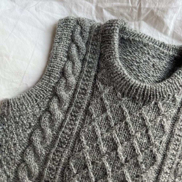 Petite knits Moby Slipover Baby in grey cable and texture pattern.