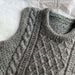 Petite knits Moby Slipover Baby in grey cable and texture pattern.