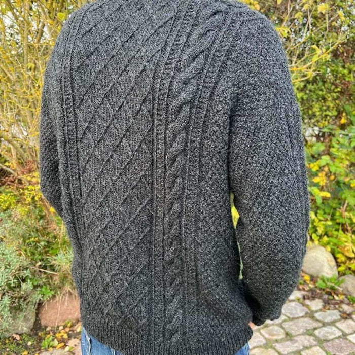 Moby Sweater Man knitting pattern by PetiteKnit in dark textured cable design.