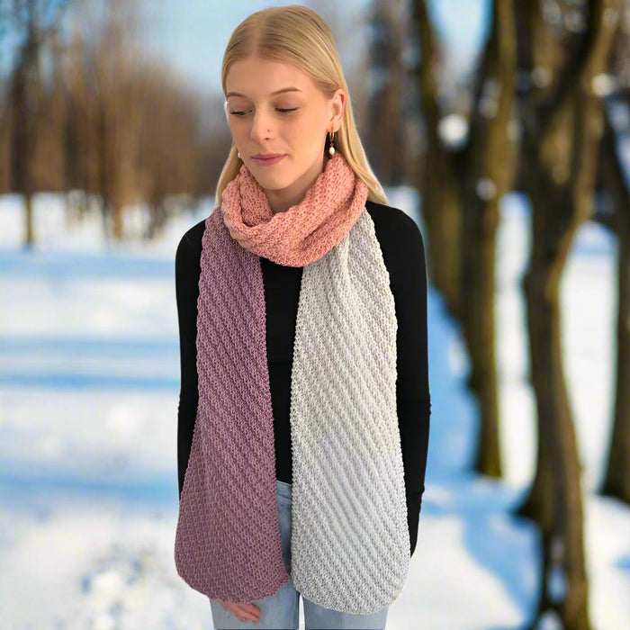 Multi-coloured scarf with diagonal rib pattern in pink and beige, knitted in Merino 12ply yarn.