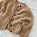 Novice Cardigan Junior Chunky Edition by PetiteKnit displayed on a white surface.