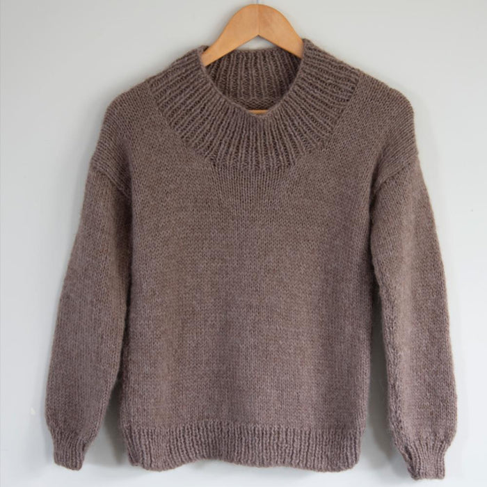 Oversized sweater knitting pattern with drop-shoulder design in Alpaca Air 12ply yarn, featuring ribbed neckline, hem, and cuffs.
