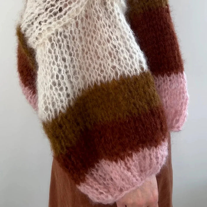 Knitted Piper Jacket cardigan with striped mohair pattern in multicolored shades, showcasing its cozy texture and stylish design.