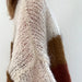 Close-up of Piper Jacket knitted in mohair yarn, showcasing a soft, textured pattern with white and brown tones.