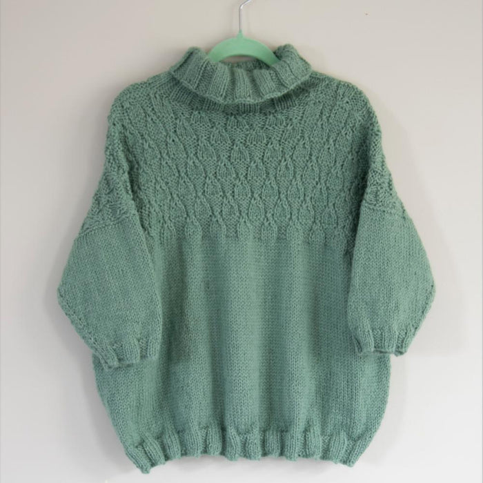 Children's poncho-jumper with textured pattern and ribbed sleeves, knitted in Muhu DK/8ply for ages 2-8.