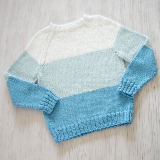 Light blue and cream raglan summer jumper for kids, knitted in Sesia Bio Sunny DK/8ply yarn.