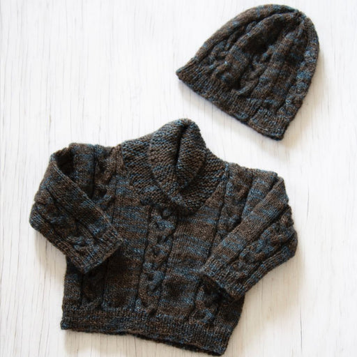 Shawl collar sweater and hat knitting pattern in Naturally Omana Print 4ply, featuring cable details for children aged 6 months to 3 years.