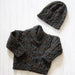 Shawl collar sweater and hat knitting pattern in Naturally Omana Print 4ply, featuring cable details for children aged 6 months to 3 years.