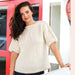 Short sleeve star sweater knitting pattern showcasing cozy design with bold textures and star motif.