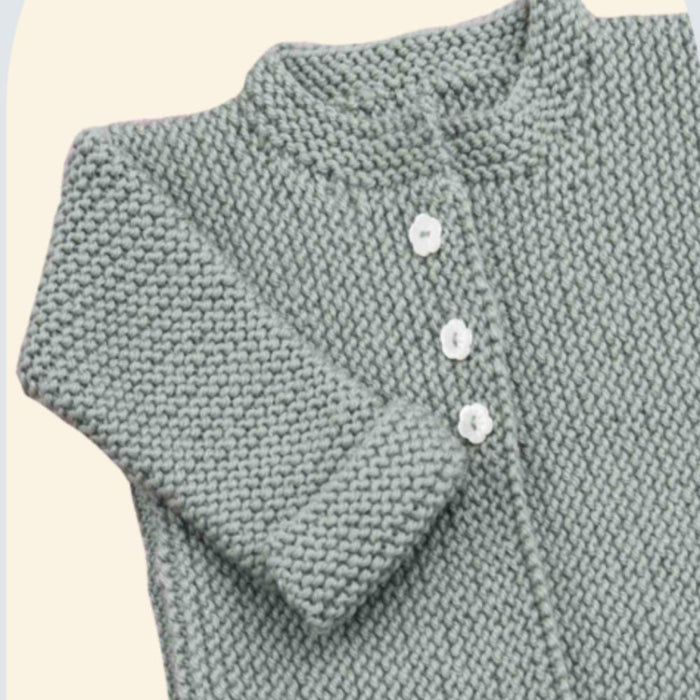 Knitted baby cardigan in garter stitch with buttoned front and fold-back cuffs.