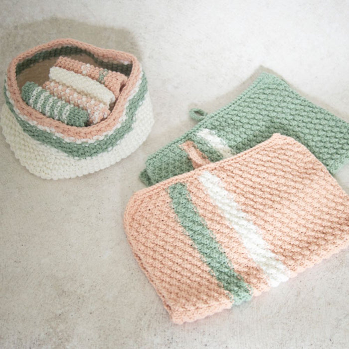 Knitting pattern for storage tub, hand towel, and face washers featuring moss and rib stitches in complementary colors.