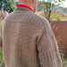 PetiteKnit Storm Sweater Man in textured brown knit pattern, outdoor setting.