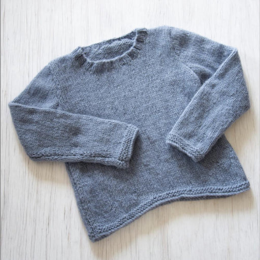Knitted gray sweater with shaped lower edge in Chaska Alpaca Air yarn.