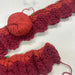 Knitting pattern with red yarn and knitted rows for Temperature Blanket 2025.
