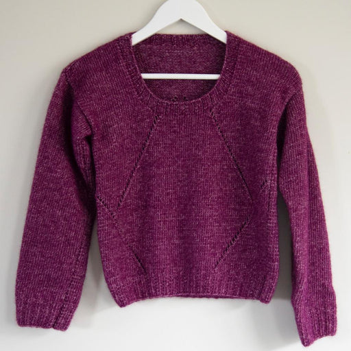 Knitted lace sweater with intricate pattern on hanger; DK/8ply yarn; vibrant purple tone.