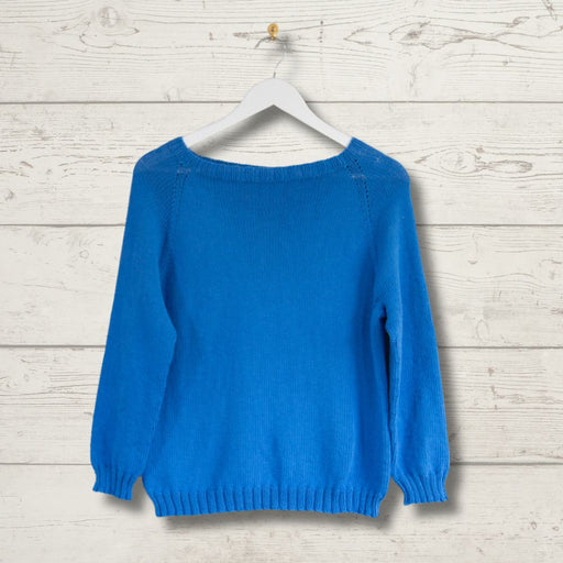 Unisex top-down summer jumper knitting pattern on hanger, blue knitwear.