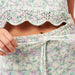 Zoe Romper Set with lace detail, featuring a sweater and shorts, knitted with Amano Inti yarn.