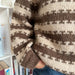 Striped junior sweater with ribbed edges by PetiteKnit, displaying brown and beige colorwork.