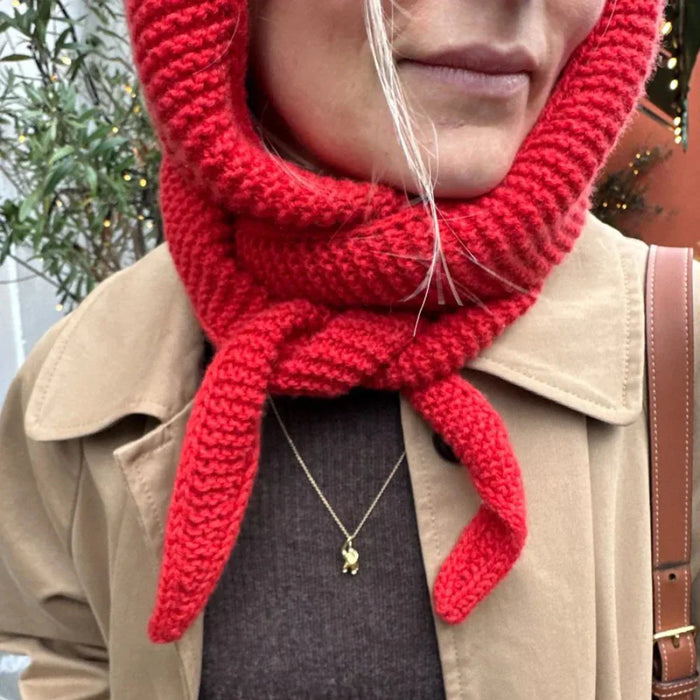 Cozy and elegant red hooded scarf from Sophie Hood knitting pattern, showcasing garter stitch with i-cord edges.