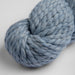 Chunky blue skein of Amano Mamacha yarn made of baby alpaca and merino wool.