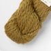 Amano Mamacha Super Chunky baby alpaca and merino wool blend yarn in warm beige, perfect for cozy knitting projects.