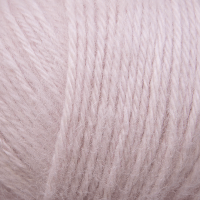 Soft pink yarn ball of Chaska Alpaca Air 12-ply, delicate and ultra-luxurious.