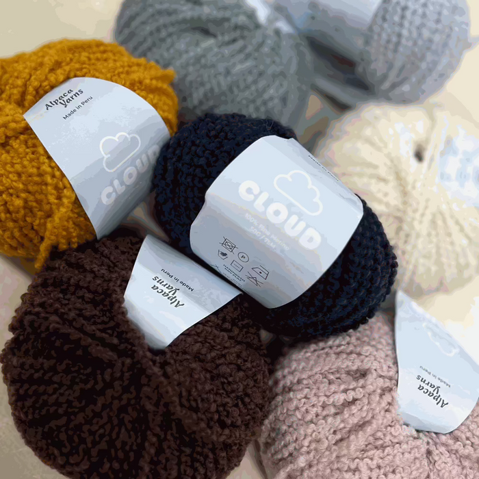 12ply Cloud Merino yarn balls in various colors, 100% Fine Merino from Peru, ideal for knitting projects.