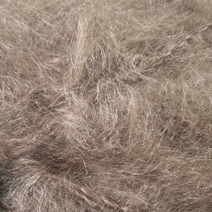 Luxurious 12ply mohair yarn from African Expressions, showcasing soft, brushed fibers for knitting.