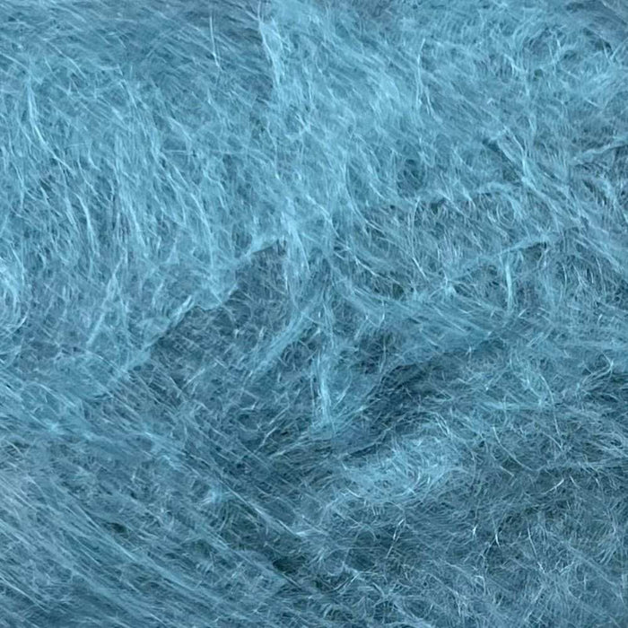Luxuriously brushed 12-ply mohair yarn in a soft blue color, ideal for knitting projects.