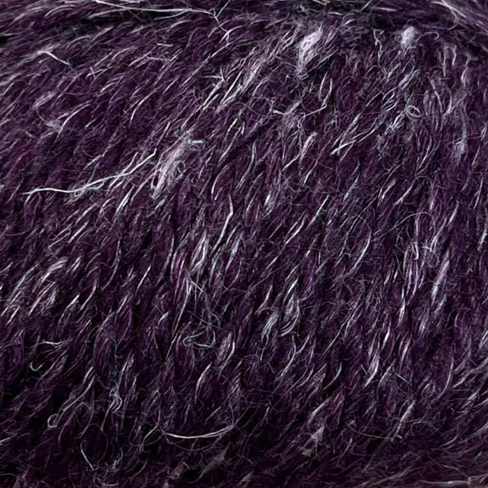 Luxurious 12-ply yarn with superfine alpaca, wool, and hemp blend for cozy knits.