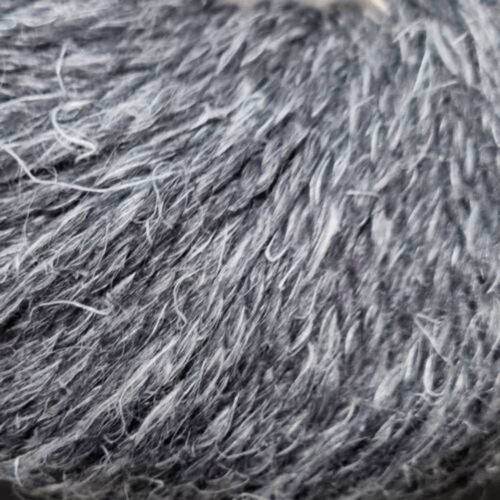 Luxurious 12-ply Naturally Moro yarn with superfine alpaca, wool, and hemp blend, showcasing a rustic, textured tweed appearance.