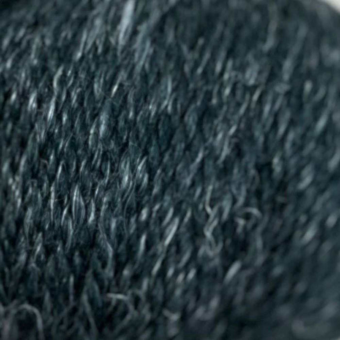 Luxurious 12-ply yarn blend of superfine alpaca, wool, and hemp with a rustic, tweedy texture.