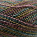 Luxurious Naturally Omana Print yarn for Omana Shawl Collar Sweater & Hat Knit Kit, featuring rich self-patterning colors and soft 4ply texture.