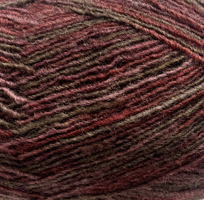 Omana Shawl Collar Sweater & Hat Knit Kit yarn in rich red-brown tone.