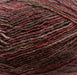 Omana Shawl Collar Sweater & Hat Knit Kit yarn in rich red-brown tone.