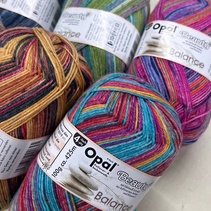 Opal Beauty Balance Sock Yarn in vibrant colors, enriched with Edelweiss and Vitamin E, 4-ply blend of wool and polyamide.