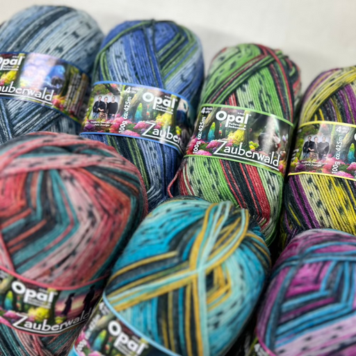 Colorful Opal Zauberwald Sock Yarn 4-ply skeins with magical self-patterning designs.