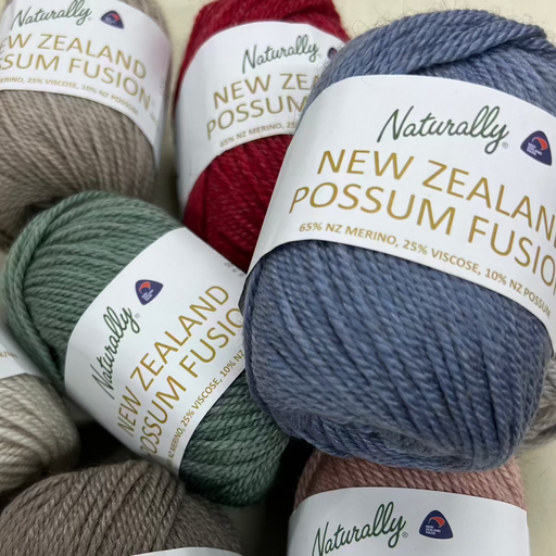 Cabled Beanie Knit Kit with Naturally New Zealand Possum Fusion yarn balls in assorted colors.