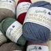 Cabled Beanie Knit Kit with Naturally New Zealand Possum Fusion yarn balls in assorted colors.