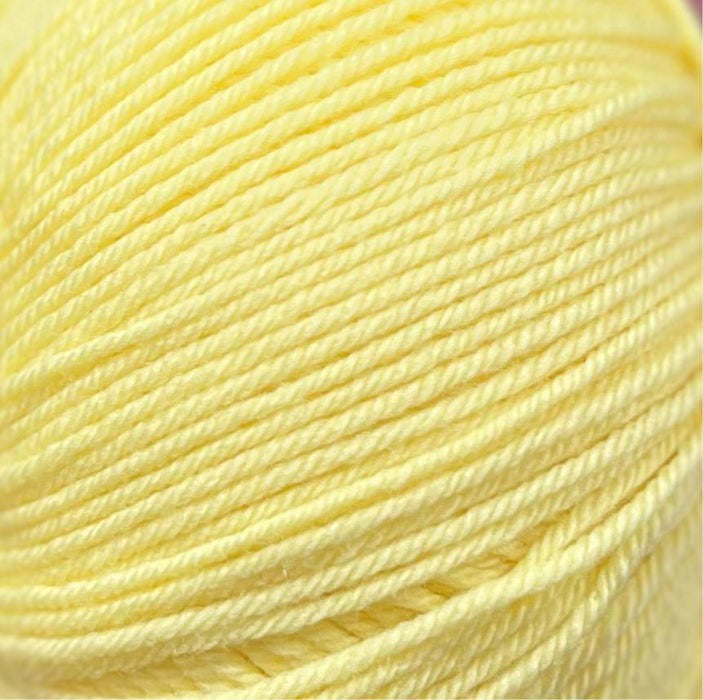 4ply Merino wool yarn, soft and machine washable, shown in a light yellow hue.