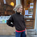 Woman wearing a hand-knitted Hannah Sweater with round neckline and oversized fit in soft stockinette stitch