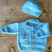 Blue baby cardigan with a pocket and matching hat — Barnaby Cardi and Hat, Lisa F BC137.