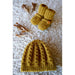 Golden baby cable hat with matching button-tab boots — Vita Hat and Boots, Lisa F BC141.