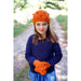 Child wearing an orange bobble hat and matching mittens — Popcorn Hat and Mittens, Lisa F LC40.