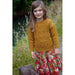Child modelling a mustard cable-and-bobble sweater — Blaze Sweater, Lisa F LF55.