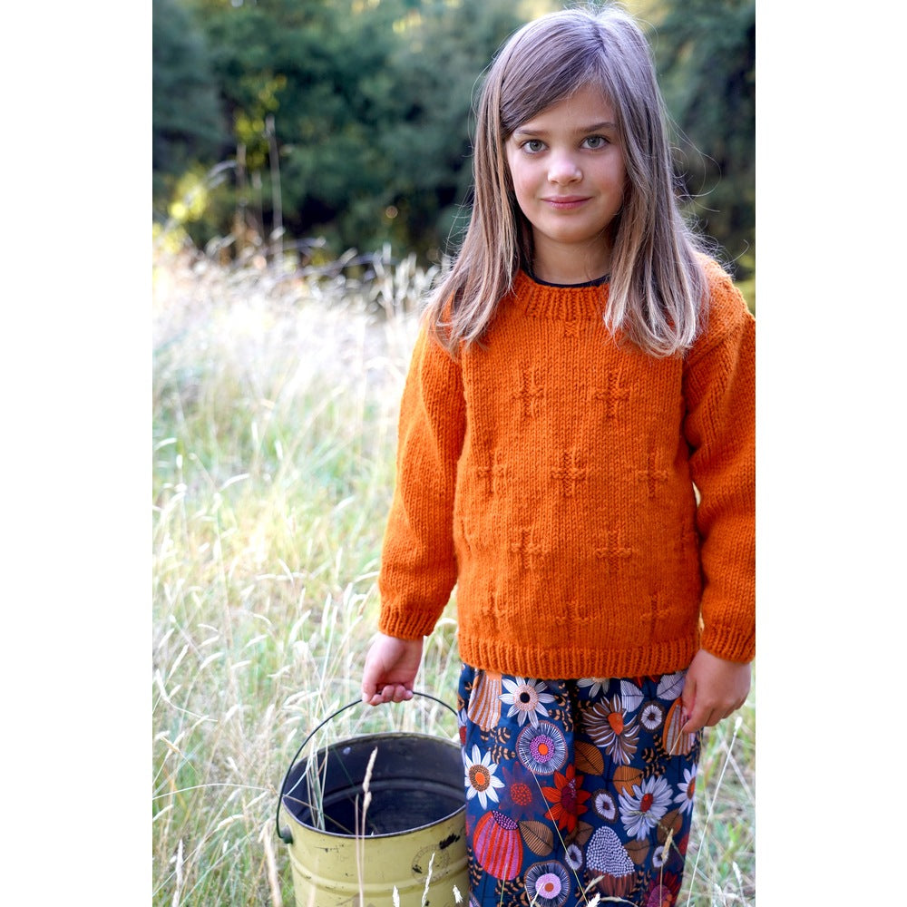 Child wearing an orange textured sweater — Ginger Sweater, Lisa F LF60.