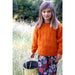 Child wearing an orange textured sweater — Ginger Sweater, Lisa F LF60.