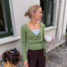 Lucy Wrap Knitting Pattern, a sage green mohair wrap blouse with crossed front and long waist ties
