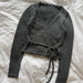 Lucy Wrap Knitting Pattern for a charcoal grey knitted wrap blouse with crossover front and long waist ties