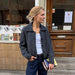 Petra Jacket Knitting Pattern featuring a dark charcoal knitted jacket with a relaxed fit and notched collar
